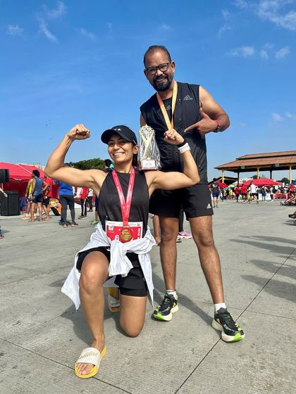 Posing with my coach after the Ajmera Thump Run. His guidance and support were instrumental in helping me secure a win and a personal best.