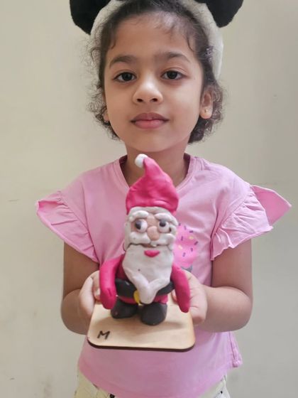 This adorable Santa gnome was sculpted from clay by one of our youngest students during our Christmas craft session.