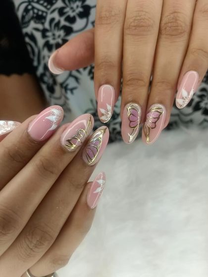 An elegant design featuring delicate butterfly wings. The combination of pink, white, and gold on a sheer base creates a soft and ethereal look.