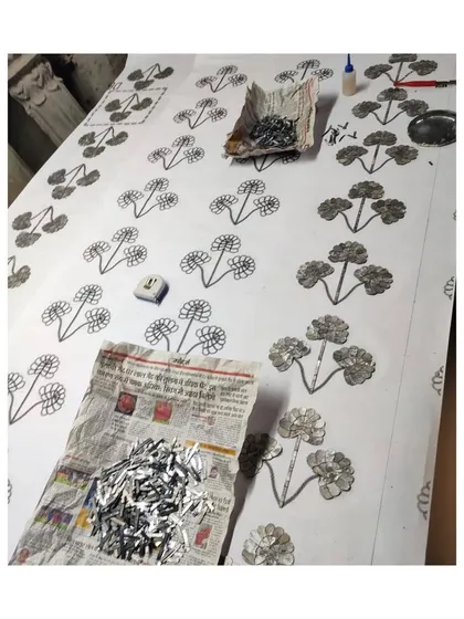 The process of laying out the intricate Thikri glass pattern, a painstaking task that requires immense precision and artistry.
