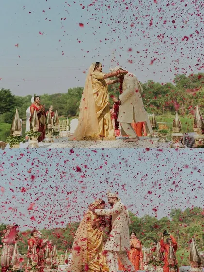 A magical moment of a petal shower during the varmala ceremony. We help coordinate these moments to create stunning, emotional photographs you'll cherish forever.