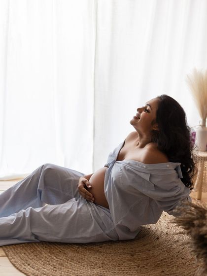 A moment of pure bliss. This mother-to-be is basking in the sunlight and the joy of her pregnancy.