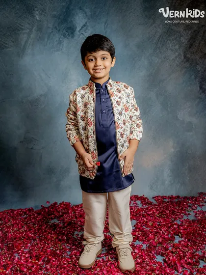 A full view of the floral bomber jacket paired with a kurta and trousers, showcasing a complete, ready-to-wear festive look.