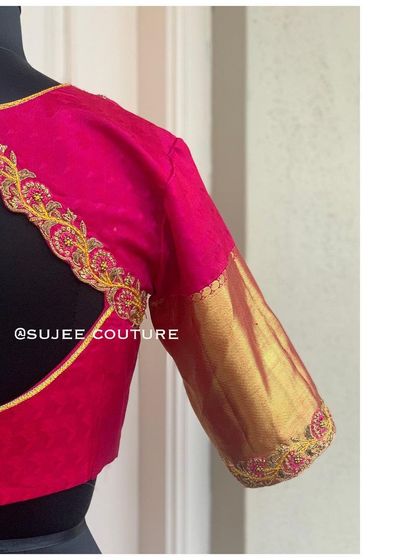 Another angle of the pink and gold blouse, highlighting the elegant curve of the back design.