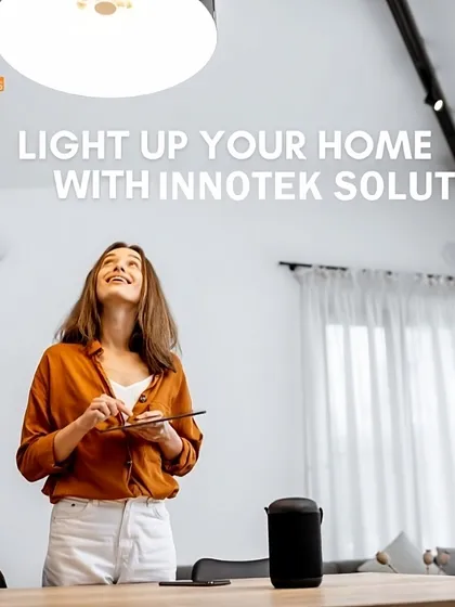 With our smart home systems, you have complete control at your fingertips. Here, a client uses a tablet to adjust the lighting in their living room, creating a bright and welcoming atmosphere with ease. Voice control via a smart speaker is also an option.