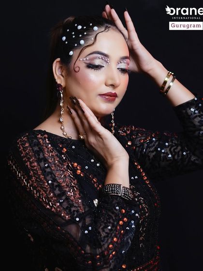 This look uses pearls and rhinestones to create a celestial, high fashion effect. I teach students how to apply embellishments securely for long lasting, intricate designs.