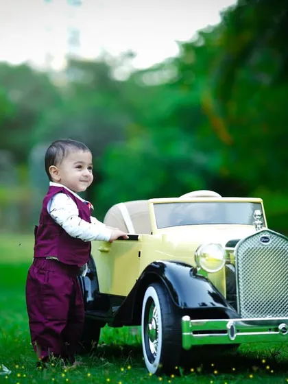A lovely profile shot of the little boy and his car, with the soft, natural light creating a beautiful glow.