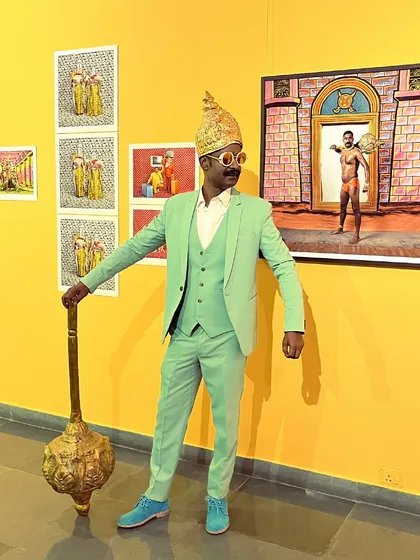 Artist Cop Shiva stands beside his work at the preview of his solo exhibition, 'No Longer A Memory'. My role is not just to sell art, but to support and develop the careers of the artists I represent, helping them bring their vision to life.