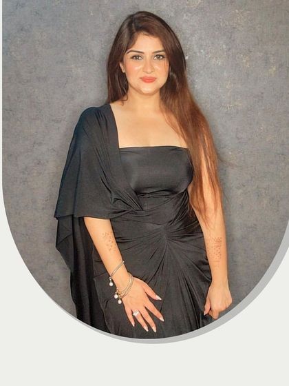 A simple, elegant styling of the black draped dress, perfect for an evening out.