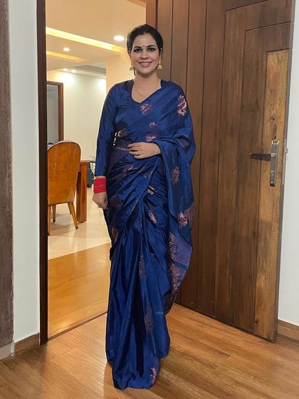 This royal blue saree with a red border is another one of my favorites. The color combination is so striking and festive.