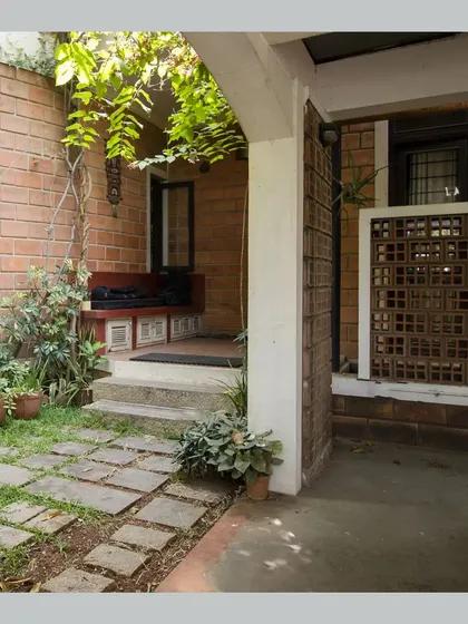 The entrance verandah or 'Jagali', with a built-in bench, providing a traditional semi-open space to transition from outside to inside.