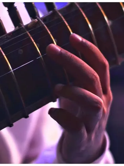 A detailed shot of my hand on the sitar strings during the Depot48 performance.