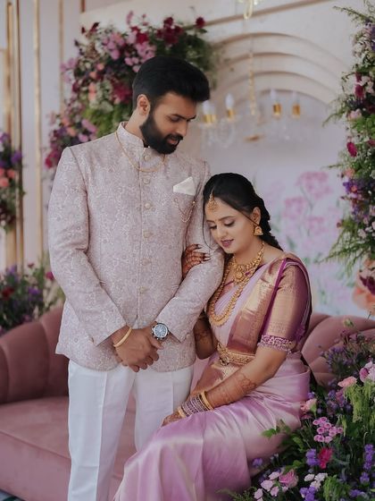 An intimate moment between the couple during their engagement photo shoot. The romantic floral decor provides a soft and beautiful setting, allowing their connection to be the focus.