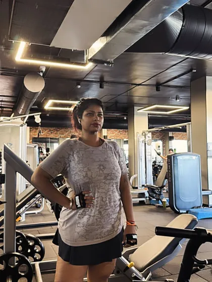 A front-facing pose during a workout session. It's important to feel good in your gym wear and confident in your body as you work towards your fitness goals.