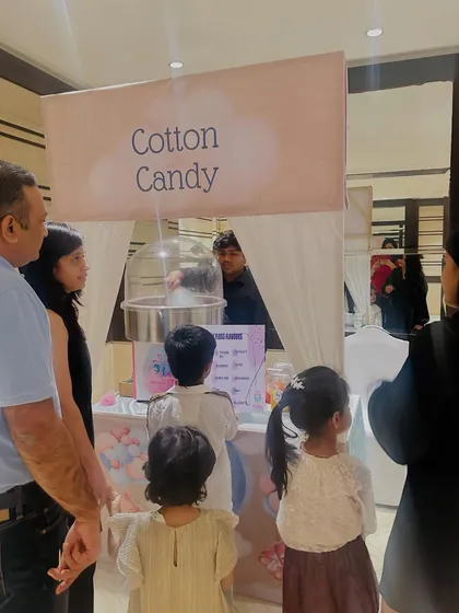 Guests of all ages lining up for a sweet treat. Our cotton candy station is always a popular spot at any birthday, wedding, or corporate event.