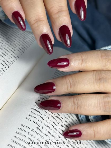 A statement set of cherry red gumgel extensions. This showcases my ability to create beautifully shaped, long-lasting extensions with a flawless, high-shine color application.