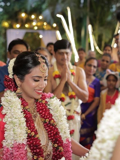 A candid moment from the ceremony. Even in action shots, the makeup looks perfect and enhances her bridal glow.