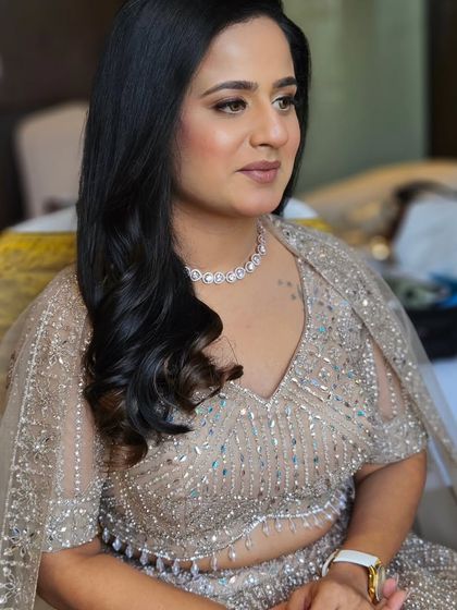 A candid shot of the bride-to-be. The makeup is subtle enough to let her natural beauty shine through.