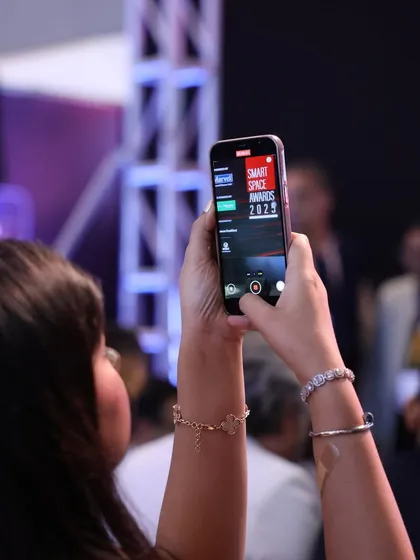 An attendee captures the moment at the Smart Space Awards, a testament to the engaging and memorable experience we create for our community.