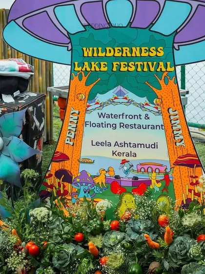 The official welcome sign for the "Wilderness Lake Festival" Mehendi. The quirky, colorful design, set in a bed of vegetables and flowers, perfectly captured the event's playful theme.