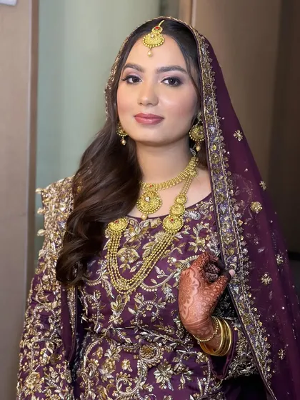 A beautiful portrait of Amena. The makeup enhances her features and complements the traditional gold jewelry.