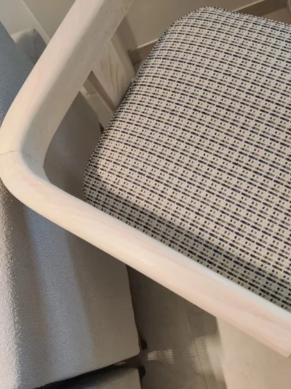 The custom dining chair, now with its seat upholstered in a beautiful patterned fabric. The final piece is a perfect blend of form and function.