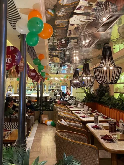 For this restaurant's Republic Day celebration, I used simple balloon strings in the Indian tricolor to decorate the ceiling, adding a festive touch without cluttering the space.