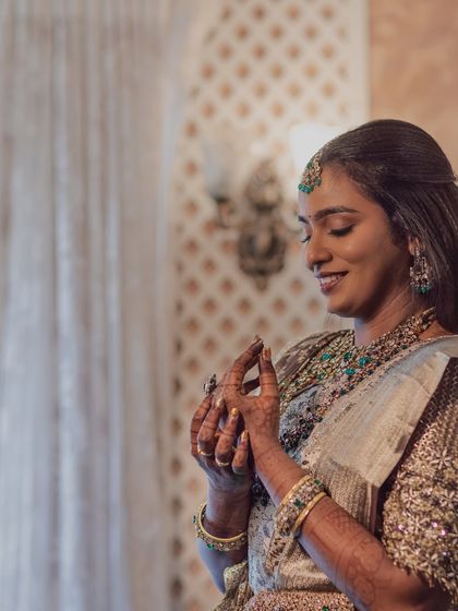 A candid shot of my Chennai bride Sruthi during her reception. The soft lighting captures the beautiful details of her makeup and the sparkle of her jewellery.