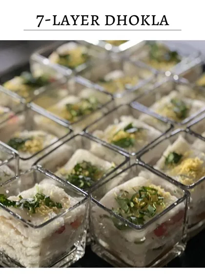 A tray of my 7-Layer Dhokla cubes ready to be served. The individual portions make it an easy and elegant appetizer for guests to enjoy while mingling.