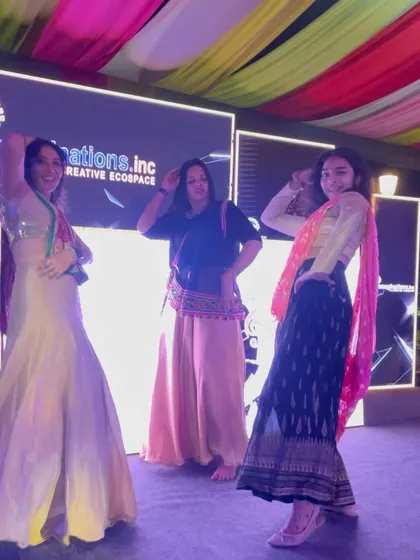 Dancing on stage with guests at the Prestige Drive Park Dandiya Night. It's all about creating a fun, interactive experience.