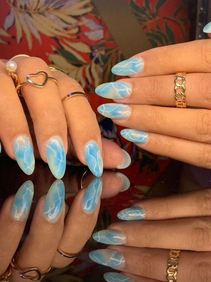 Another angle of the stunning blue marble effect nails.