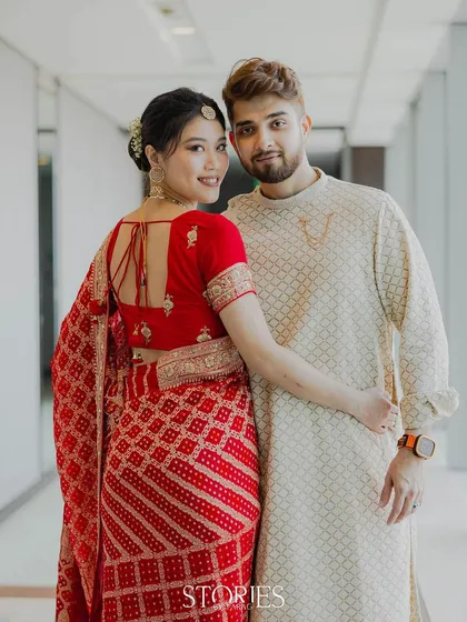 It was an honor to photograph the popular influencer couple, Nick and Carrie. This portrait captures their graceful presence as they embrace, dressed in beautiful traditional Indian attire.