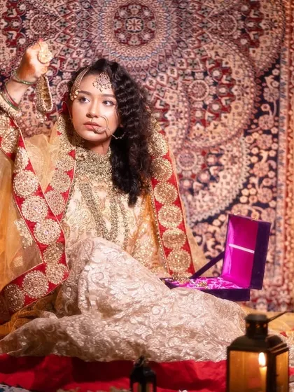 A full-length view of the Heeramandi-inspired look, demonstrating how makeup, hair, and outfit come together for a complete and authentic portrayal.