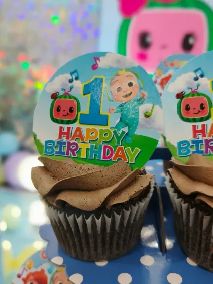 Here are the Cocomelon cupcakes on display at the party. They are a great addition to a themed cake and super easy for little guests to enjoy.
