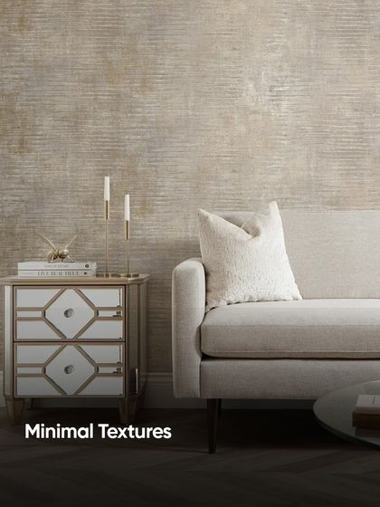 Sometimes, all a room needs is a minimal texture. This wallpaper adds a subtle, sophisticated pattern to the wall, providing a backdrop that is more interesting than plain paint but still allows the furniture to stand out.