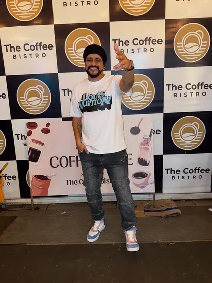 Posing in front of The Coffee Bistro's backdrop after a successful and unique event.