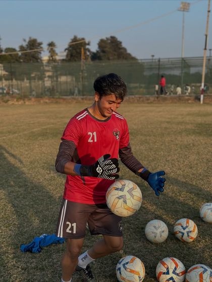 Our goalkeeper working on his handling and reflexes. A keeper's agility and confidence are built through countless hours of dedicated practice.