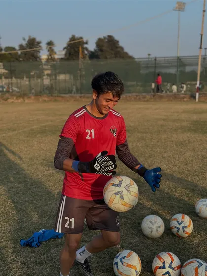 Our goalkeeper working on his handling and reflexes. A keeper's agility and confidence are built through countless hours of dedicated practice.