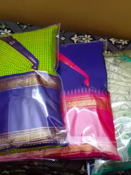 Three colorful sarees, neatly packed and ready for dispatch from my Jayanagar location. The clear packaging helps you easily identify each saree.