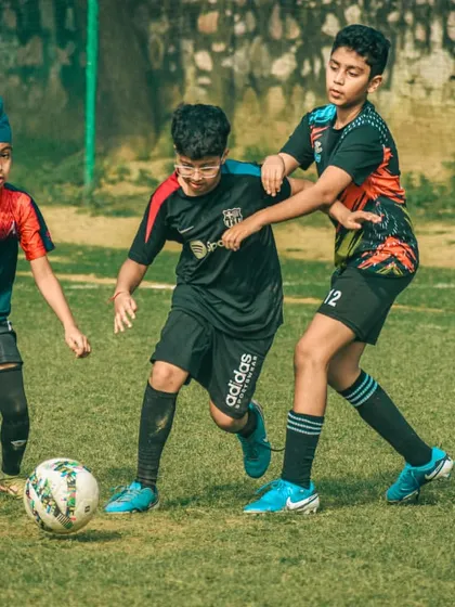 Players from different teams battle for control in the midfield, a key aspect of any football match.