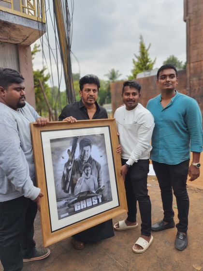 The team and I presenting the large, framed 'Ghost' artwork on set.