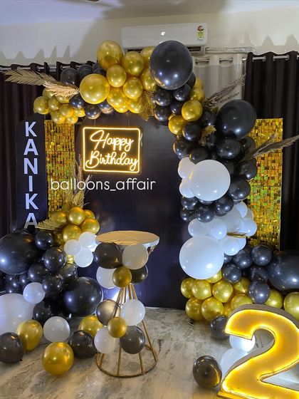 Another angle of the black and gold 28th birthday decoration.