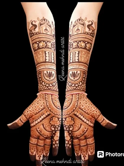 This full-arm design is perfect for the bride's family. It features traditional elements like peacocks, lotuses, and architectural domes, creating a rich and complete look.