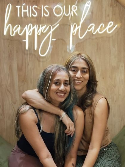 A warm hug between friends after their beauty session. It's all about feeling good and sharing that feeling with others.