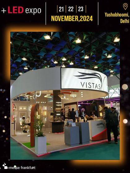 The Vistas booth features a sophisticated, circular design with an array of elegant fixtures, attracting design-focused professionals.