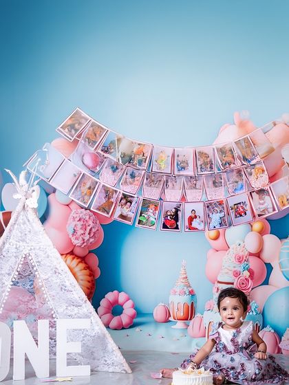 A closer look at the beautiful memories. This shot focuses on the photo banner, a wonderful and personal touch that I offer to showcase your baby's growth over their first year.