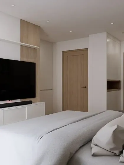 A low-angle view of the TV wall, emphasizing the clean, floating design of the console. This minimalist approach helps make the room feel larger.