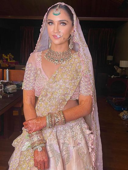 The complete look with the dupatta, showcasing the elegant hairstyle.