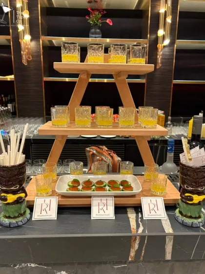 This is our molecular bar setup. The tray in the front holds edible cocktails, a form of molecular gastronomy that surprises guests with unexpected textures and flavors.