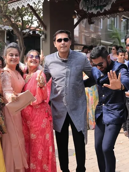 The whole family grooving together in the baraat. These are the candid moments of collective joy that make a wedding so special.